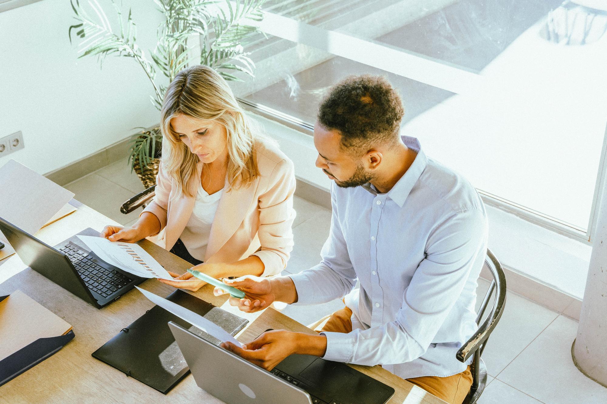 Professional consultant reviewing finances with client